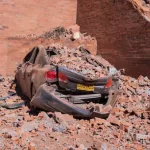 CALI, Aug. 10, 2026 -- Photo taken on Aug. 10, 2026 shows a damaged car after an earthquake in Cali, Colombia. Colombia declared a state of national disaster on Monday after a magnitude 7.4 earthquake struck the country's west earlier in the day and kill STR / Xinhua News / Europa Press / ContactoPhoto